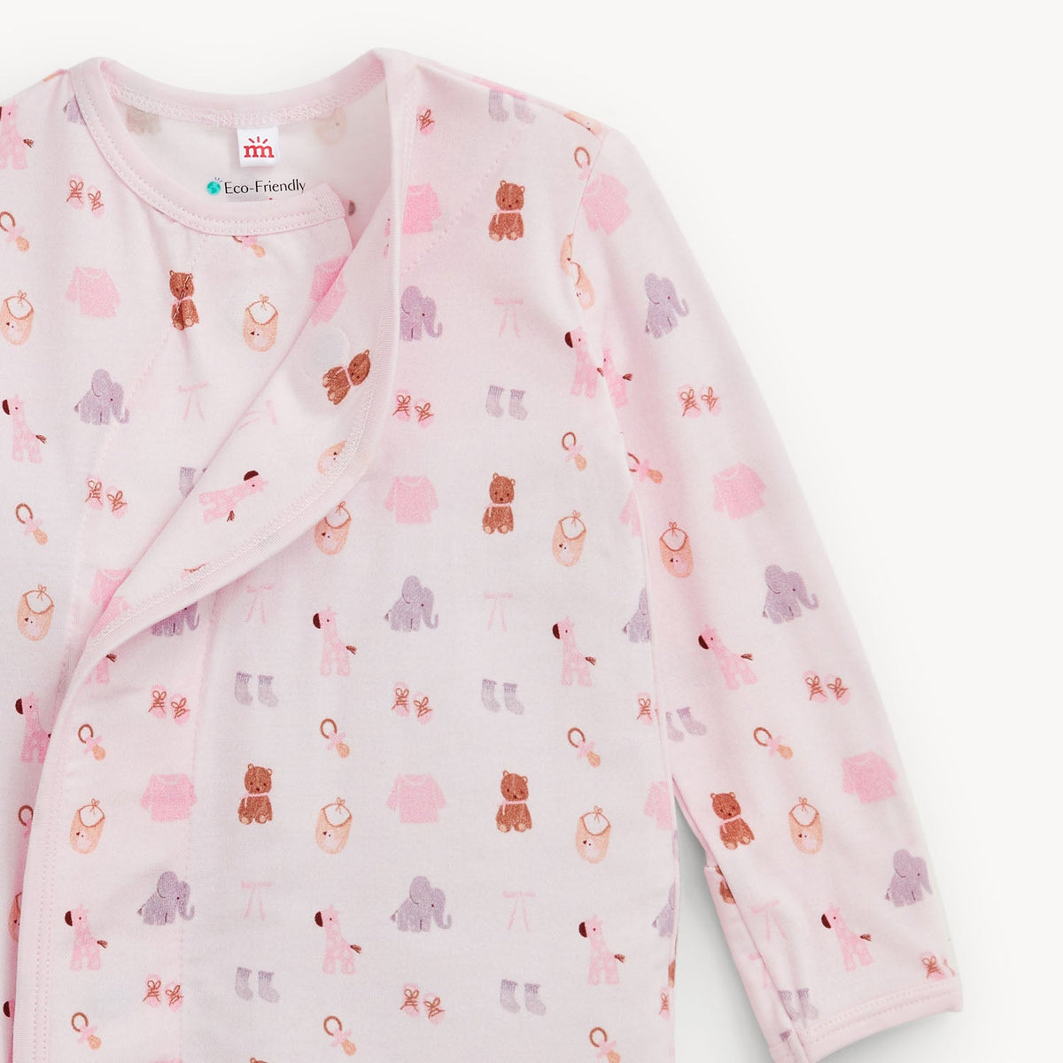 A long-sleeve baby wrap jacket in light pink, featuring an all-over playful print of teddy bears, elephants, and baby booties in pink, purple, and brown. The brand 'EazyFriendly' is visible on the inner neck label.