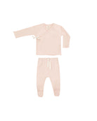 Pink baby outfit with top and pants on a white background