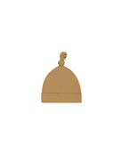 Beige baby hat with a knot on a white background