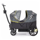 Black and gray stroller with a transparent rain cover on a white background