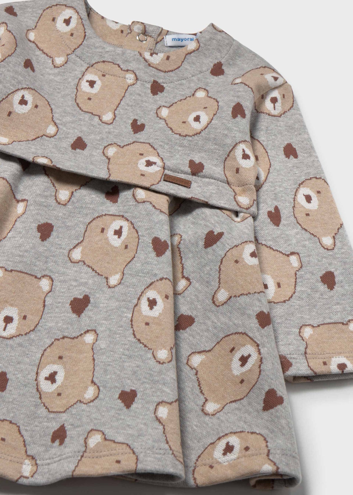 Featuring an all-over print of teddy bears and small hearts in brown and beige.