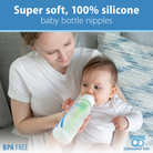 Woman holding a baby and a bottle with text about super soft, 100% silicone baby bottle nipples.