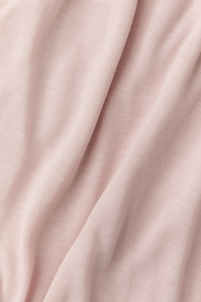 Close-up of pink fabric with folds