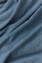 Close-up of blue fabric with visible texture