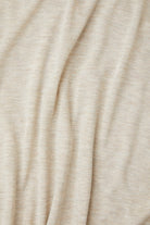 Close-up of beige fabric with folds