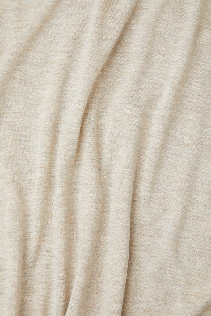 Close-up of beige fabric with folds