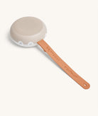 Portable speaker with a wooden handle on a white background