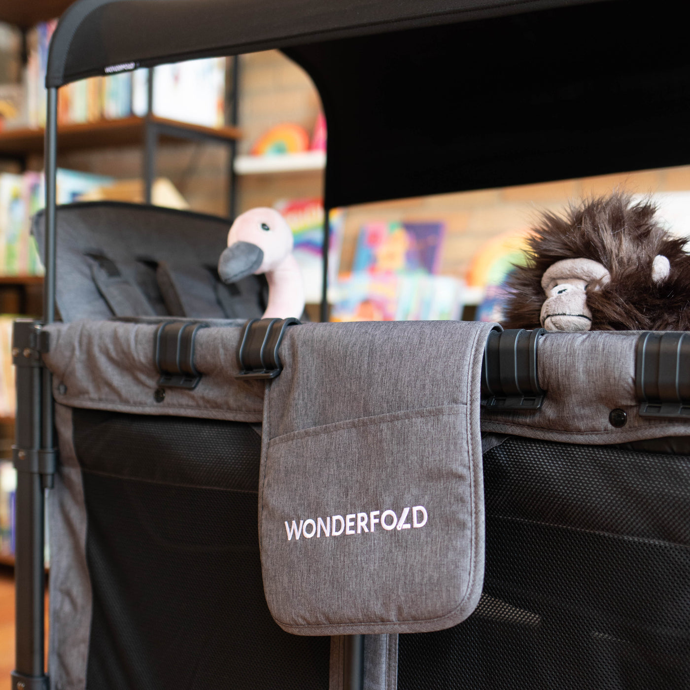 Side vide of the Wonderfold W4 Wagon with a Jellycat Ostrich and Gorilla as the passengers