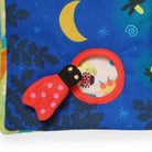 Children's soft book with ladybug and moon design on a blue background