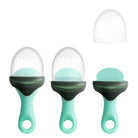 Three green pet food scoops with clear silicone lids on a white background