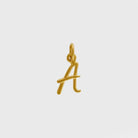 Gold letter 'A' charm on a light gray background